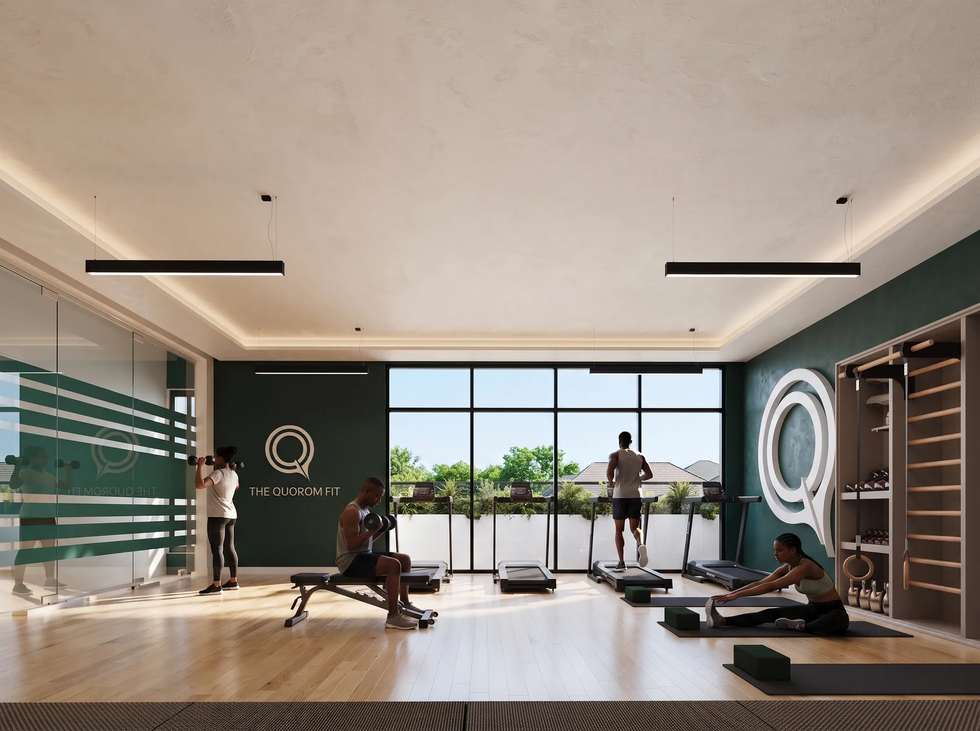 The gym with treadmills facing full-height windows