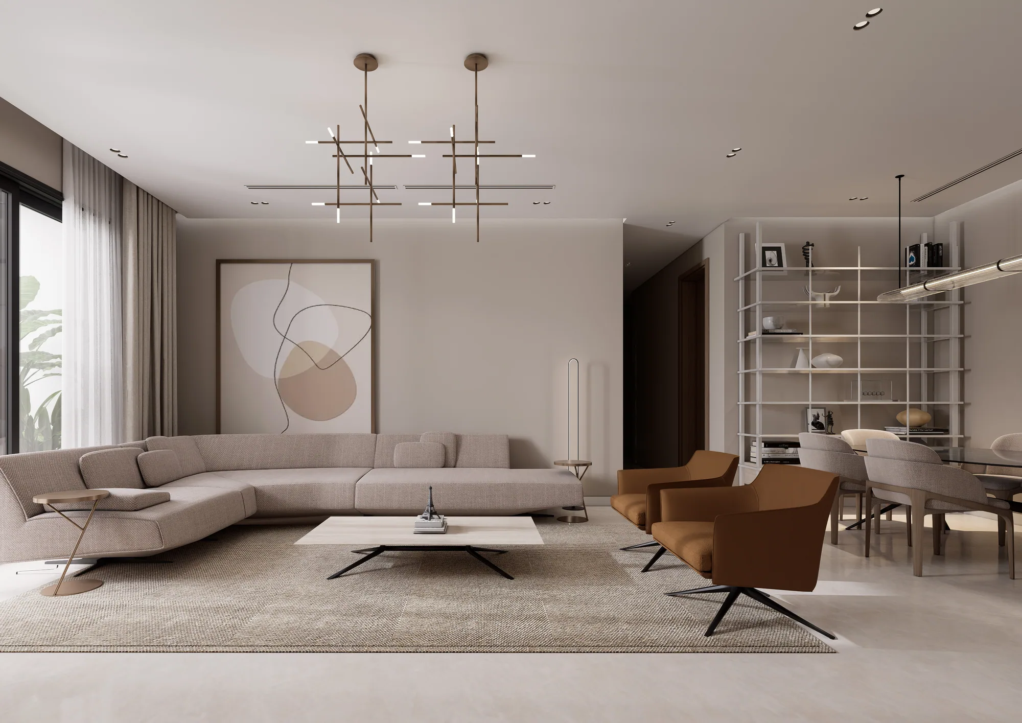 Apartment living room with a long sofa, tan armchairs and open shelving