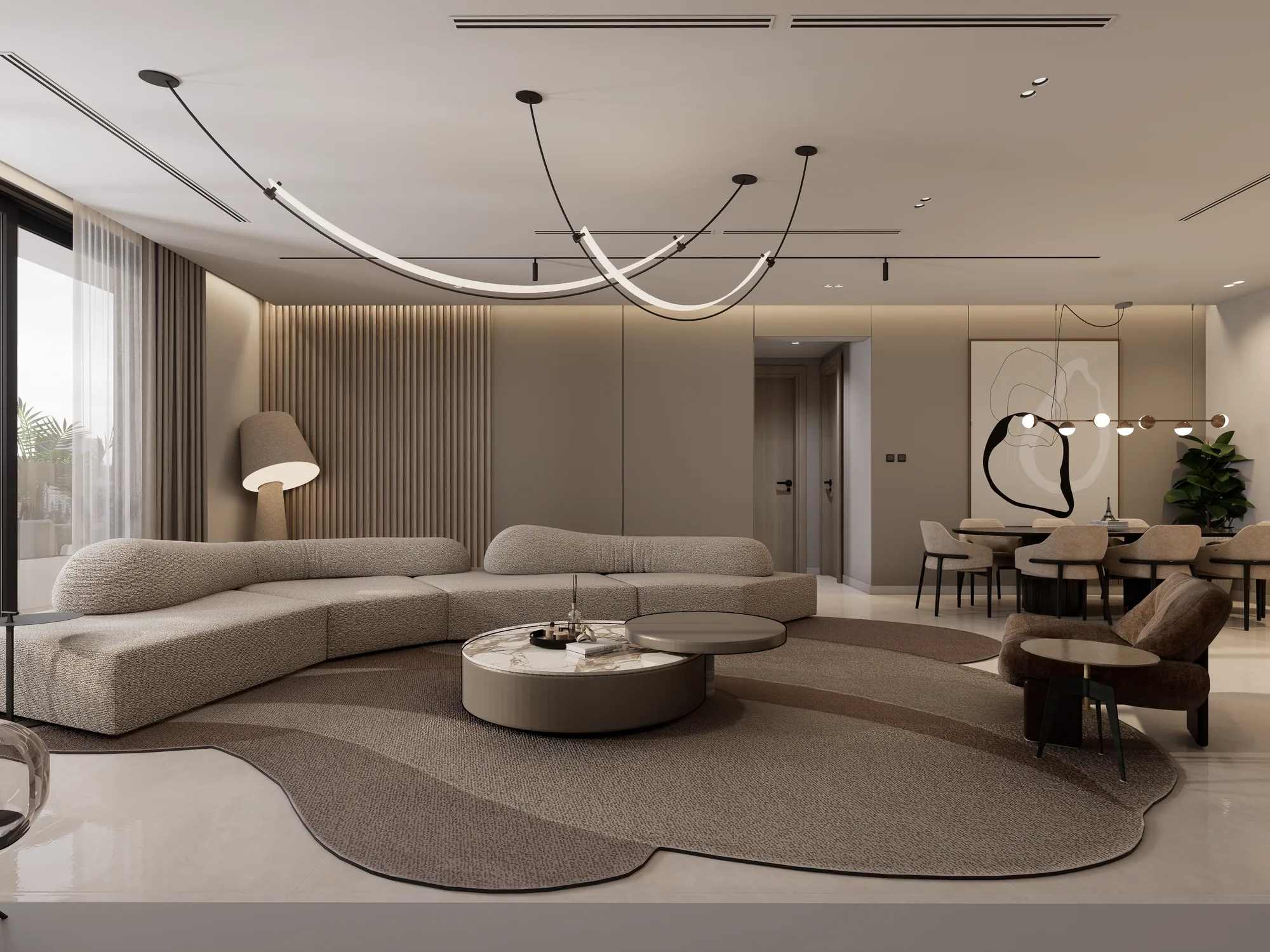 Penthouse living room with a curved sofa, sculptural pendant light and dining area beyond